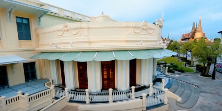 The exterior of the Queen Sirikit Museum of Textiles, showing a beautifully designed building with intricate architectural details.